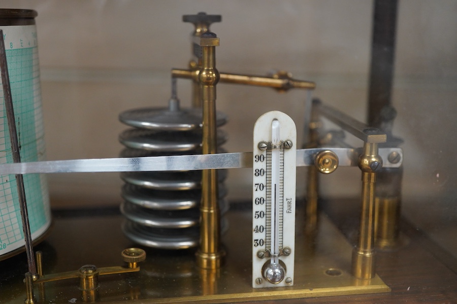An early 20th century oak cased barograph, without maker’s mark, however stamped 418 into the case and with an unusual hinged lid, ivory backed thermometer and integral drawer beneath containing two boxed Negretti & Zamb